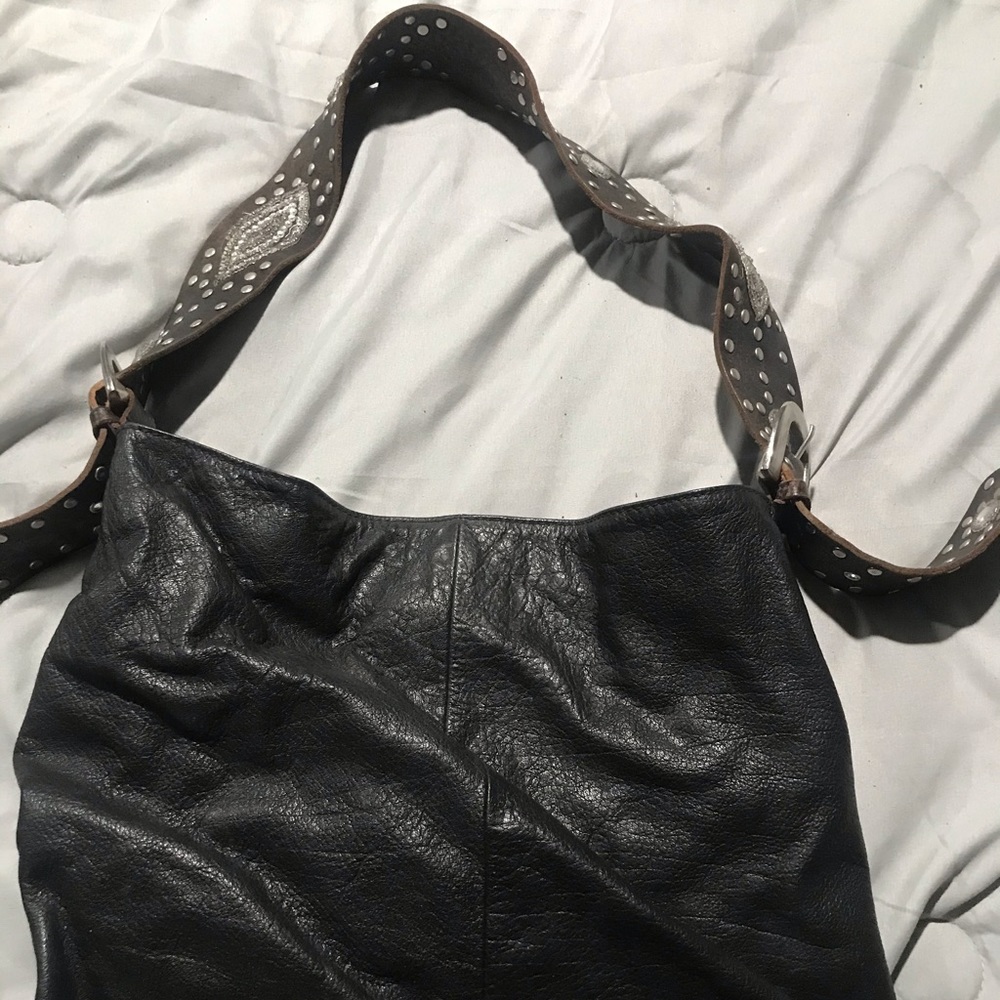 Black leather hobo bag w/embleshed strap by Jlo